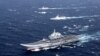 FILE - China's Liaoning aircraft carrier with accompanying fleet conducts a drill in an area of the South China Sea, in this photo taken in December 2016. 