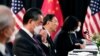 中共政治局委员杨洁篪（中）和中国外长王毅在阿拉斯加美中高层会谈上。（2021年3月18日） 