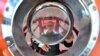 FILE - Jean-Jacques Savin works on the construction of a ship made from a barrel on Nov. 15, 2018, at the shipyard in Ares, France.