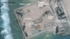 A satellite image released by the Asian Maritime Transparency Initiative at Washington's Center for Strategic and International Studies shows construction of possible radar tower facilities in the Spratly Islands in the disputed South China Sea in this im