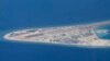 Chinese structures and an airstrip on the man-made Subi Reef at the Spratly group of islands in the South China Sea are seen from a Philippine Air Force C-130 transport plane of the Philippine Air Force, April 21, 2017. The South China Sea issue is expect